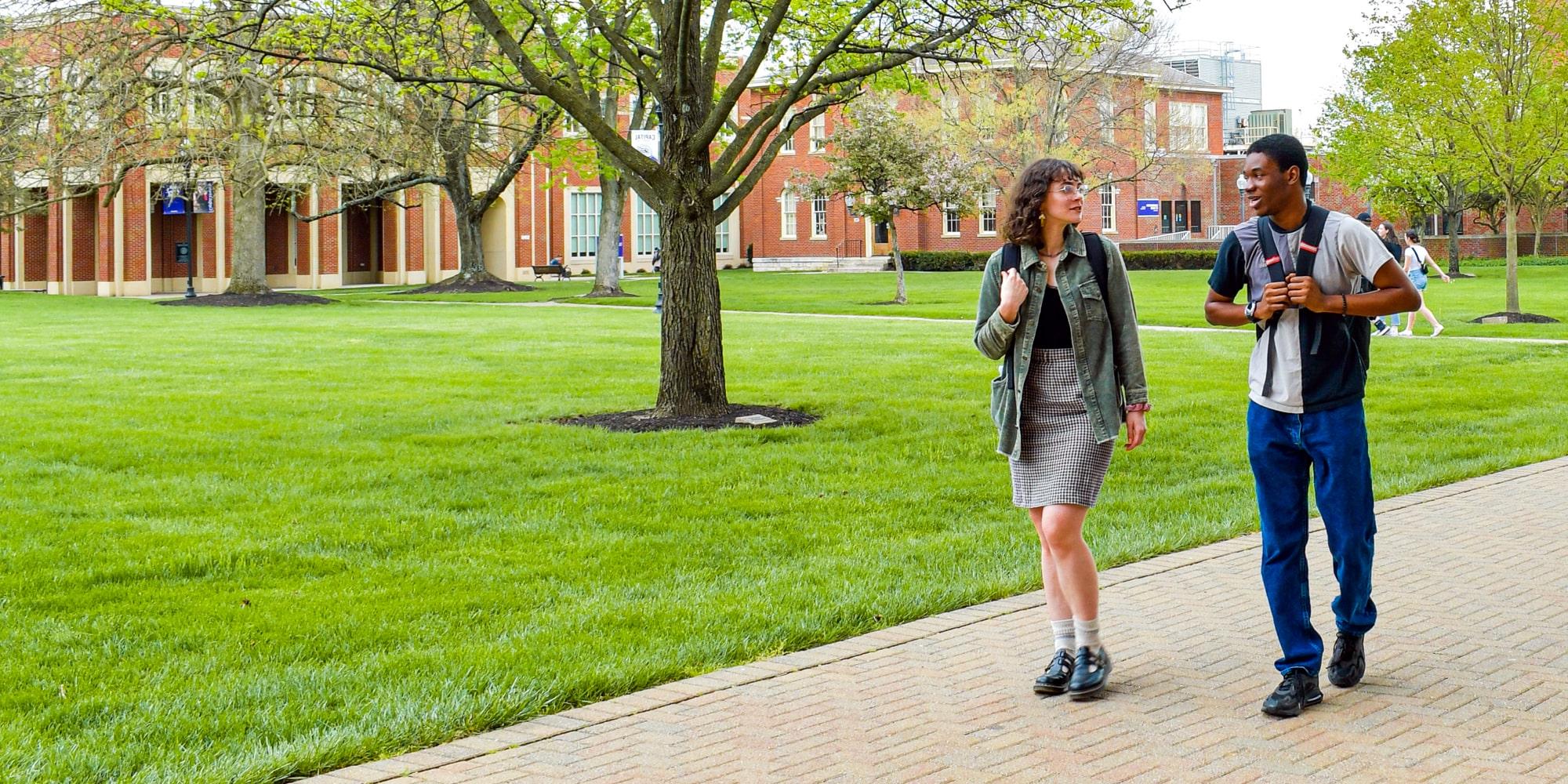 Students Walking By Library Min